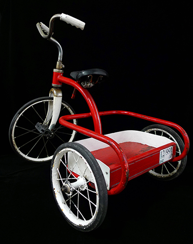 red and white 1950s children's tricycle